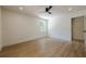 A well lit room featuring wood floors and two large windows at 3350 Pine Meadow Nw Rd, Atlanta, GA 30327