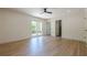 Open bedroom featuring hardwood floors, sliding glass doors, and ensuite bathroom at 3350 Pine Meadow Nw Rd, Atlanta, GA 30327