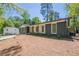 Charming single-story home with painted brick, modern door, and manicured front yard at 3350 Pine Meadow Nw Rd, Atlanta, GA 30327