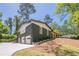 Beautiful two-story home with painted brick, 3-car garage, and mature trees at 3350 Pine Meadow Nw Rd, Atlanta, GA 30327