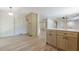 Bright eat-in kitchen featuring wooden floors, white walls, and custom cabinets at 3350 Pine Meadow Nw Rd, Atlanta, GA 30327