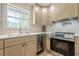 Kitchen featuring stainless steel appliances, a window over the sink, and modern countertops at 3350 Pine Meadow Nw Rd, Atlanta, GA 30327