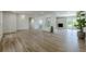 Bright open-concept living room featuring beautiful hardwood floors and a cozy fireplace at 3350 Pine Meadow Nw Rd, Atlanta, GA 30327