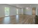 Spacious living room with hardwood floors, large windows, and neutral color palette at 3350 Pine Meadow Nw Rd, Atlanta, GA 30327