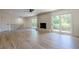 Open living space featuring a fireplace and sliding glass doors leading to the backyard at 3350 Pine Meadow Nw Rd, Atlanta, GA 30327