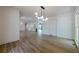 Open-concept living room with hardwood floors and a view of other rooms at 3350 Pine Meadow Nw Rd, Atlanta, GA 30327