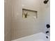 Tiled shower with a built in shelf at 3350 Pine Meadow Nw Rd, Atlanta, GA 30327