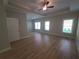 Large bedroom features tray ceiling, fan, and multiple windows at 2071 Westside Blvd, Atlanta, GA 30318