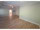 Spacious primary bedroom with tray ceiling, fan and ensuite bathroom access at 2071 Westside Blvd, Atlanta, GA 30318