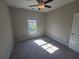 Bright bedroom with ceiling fan, window and neutral walls at 2071 Westside Blvd, Atlanta, GA 30318
