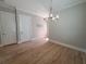 Spacious dining room features modern lighting and hardwood floors at 2071 Westside Blvd, Atlanta, GA 30318