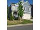 Beautiful two story traditional home with a well manicured lawn on a sunny day at 2071 Westside Blvd, Atlanta, GA 30318