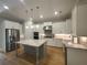 Bright kitchen featuring white cabinets, granite countertops, and stainless steel appliances at 2071 Westside Blvd, Atlanta, GA 30318