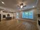 Open floorplan featuring the kitchen with a center island, hardwood floors, and a fireplace at 2071 Westside Blvd, Atlanta, GA 30318
