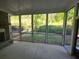 Inviting screened porch with backyard views, creating a seamless connection with nature at 2071 Westside Blvd, Atlanta, GA 30318