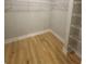 Walk-in closet features wood floors, wire shelving and ample storage space at 2071 Westside Blvd, Atlanta, GA 30318