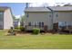 A spacious backyard featuring a well-maintained lawn and a charming wooden deck, perfect for outdoor relaxation at 2602 Avery Park Cir, Atlanta, GA 30360