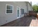 Exterior of home with wood deck in backyard, offering a seamless transition to outdoor living at 2602 Avery Park Cir, Atlanta, GA 30360