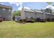 A verdant backyard boasting a generous lawn and a well-kept wooden deck, inviting outdoor activities and enjoyment at 2602 Avery Park Cir, Atlanta, GA 30360