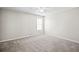 Comfortable bedroom with neutral paint and carpeting, illuminated by natural light at 2602 Avery Park Cir, Atlanta, GA 30360