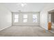 Expansive bedroom with three large windows and neutral carpeting for a serene setting at 2602 Avery Park Cir, Atlanta, GA 30360