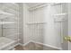 Walk-in closet with custom shelving and carpet, providing ample storage space at 2602 Avery Park Cir, Atlanta, GA 30360