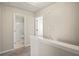 Hallway showcasing access to bathroom and bedroom, with neutral paint and carpeted floors at 2602 Avery Park Cir, Atlanta, GA 30360