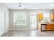 Bright eat-in kitchen features wood cabinets, laminate flooring, and stainless steel appliances at 2602 Avery Park Cir, Atlanta, GA 30360