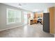 Modern kitchen with stainless steel appliances, wood cabinets, and bright, neutral paint at 2602 Avery Park Cir, Atlanta, GA 30360