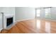 Inviting living room featuring hardwood floors, natural light, and an elegant fireplace at 2602 Avery Park Cir, Atlanta, GA 30360