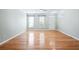 Light-filled living room with beautiful hardwood floors and large windows with natural light at 2602 Avery Park Cir, Atlanta, GA 30360