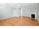 Spacious living room boasting hardwood flooring, gray walls, a fan, and a fireplace at 2602 Avery Park Cir, Atlanta, GA 30360