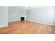 Bright living room with gleaming hardwood floors and a cozy fireplace with marble hearth at 2602 Avery Park Cir, Atlanta, GA 30360
