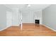 Inviting living room featuring hardwood floors, a ceiling fan, and a fireplace at 2602 Avery Park Cir, Atlanta, GA 30360
