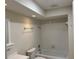 Cozy bathroom featuring a shower-tub combination with white tile surround at 3071 Colonial Way # K, Atlanta, GA 30341