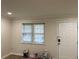 Bright living room with fresh paint, crown molding and a window for natural light at 3071 Colonial Way # K, Atlanta, GA 30341