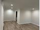 Spacious living room featuring wood-look floors, fresh paint and recessed lighting at 3071 Colonial Way # K, Atlanta, GA 30341