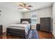 Bedroom with a bed, dresser, ceiling fan, and natural light from the window at 161 Hunters Chase, Mcdonough, GA 30253