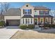 Charming two-story home with a welcoming front porch and a well-manicured lawn, boasting great curb appeal at 161 Hunters Chase, Mcdonough, GA 30253