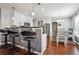 Modern kitchen with stainless steel appliances, breakfast bar seating, and hardwood floors at 161 Hunters Chase, Mcdonough, GA 30253