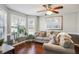 Cozy living room with plush seating, ample natural light, and hardwood floors, creating a comfortable and inviting space at 161 Hunters Chase, Mcdonough, GA 30253