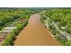 Overhead angle of the Chattahoochee River featuring equestrian facilities and a residential area at 171 Riverview Trl, Roswell, GA 30075