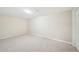Unfinished basement with neutral carpeting, providing a blank canvas for customization at 171 Riverview Trl, Roswell, GA 30075