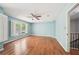 Bedroom with hardwood floors, ceiling fan, and plenty of natural light at 171 Riverview Trl, Roswell, GA 30075