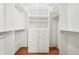 Organized walk-in closet with custom shelving and drawers, perfect for storage and organization at 171 Riverview Trl, Roswell, GA 30075