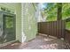 Wood deck area showcasing an access door to the home and exterior elements; ideal for outdoor living at 171 Riverview Trl, Roswell, GA 30075