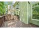 A wood deck, adjacent to the light green siding of the home, ideal for outdoor relaxation and gatherings at 171 Riverview Trl, Roswell, GA 30075
