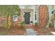 Charming brick home featuring a beautiful front door, manicured landscaping, and inviting entrance at 171 Riverview Trl, Roswell, GA 30075