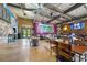 Large interior area with stage, seating, bar area and 'The Backyard' exit at 171 Riverview Trl, Roswell, GA 30075