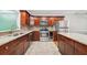 Modern kitchen with stainless steel appliances, granite countertops, and beautiful wood cabinetry at 171 Riverview Trl, Roswell, GA 30075